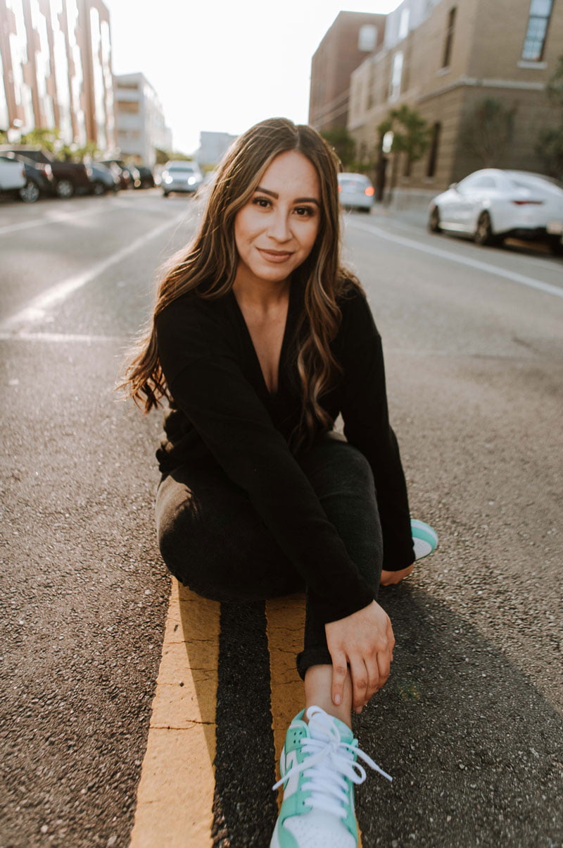 young woman posing on street