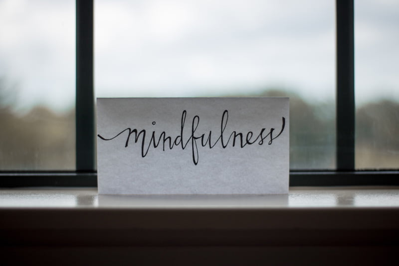 mindfulness sign at window